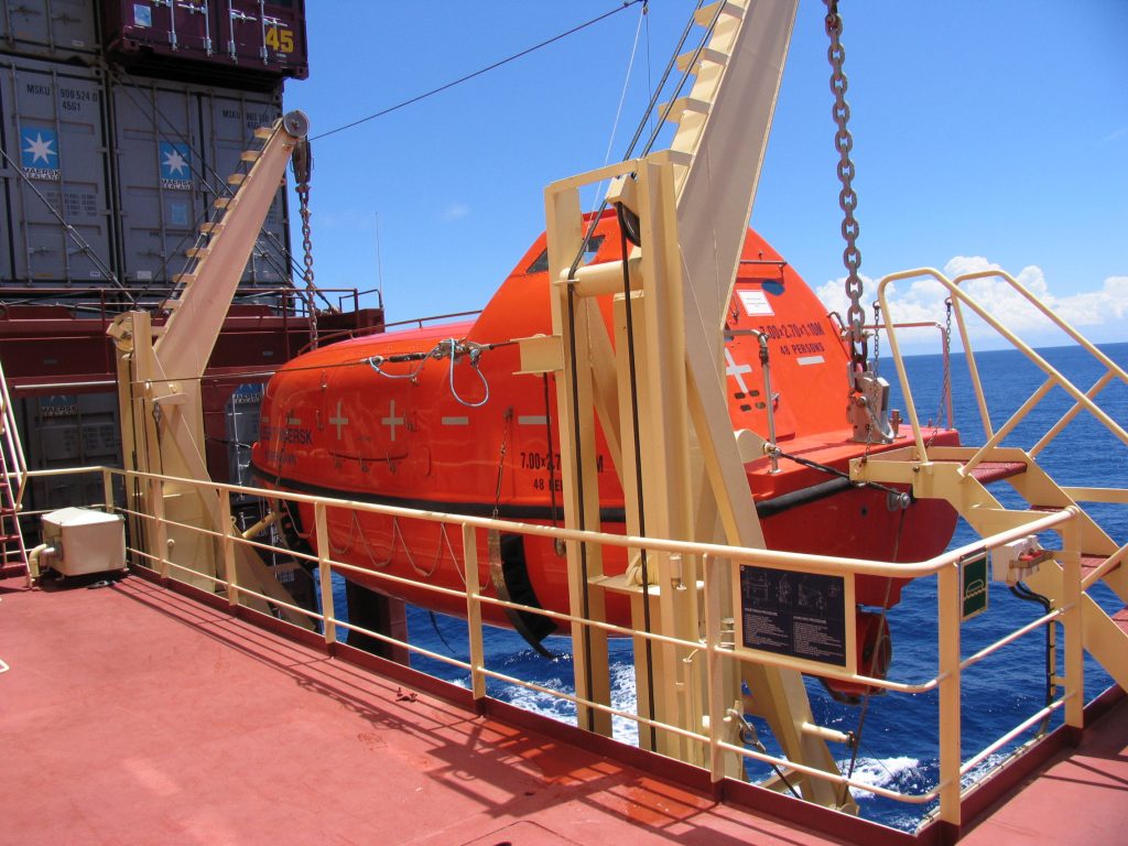 Lifeboat mounted on davits aboard a vessel