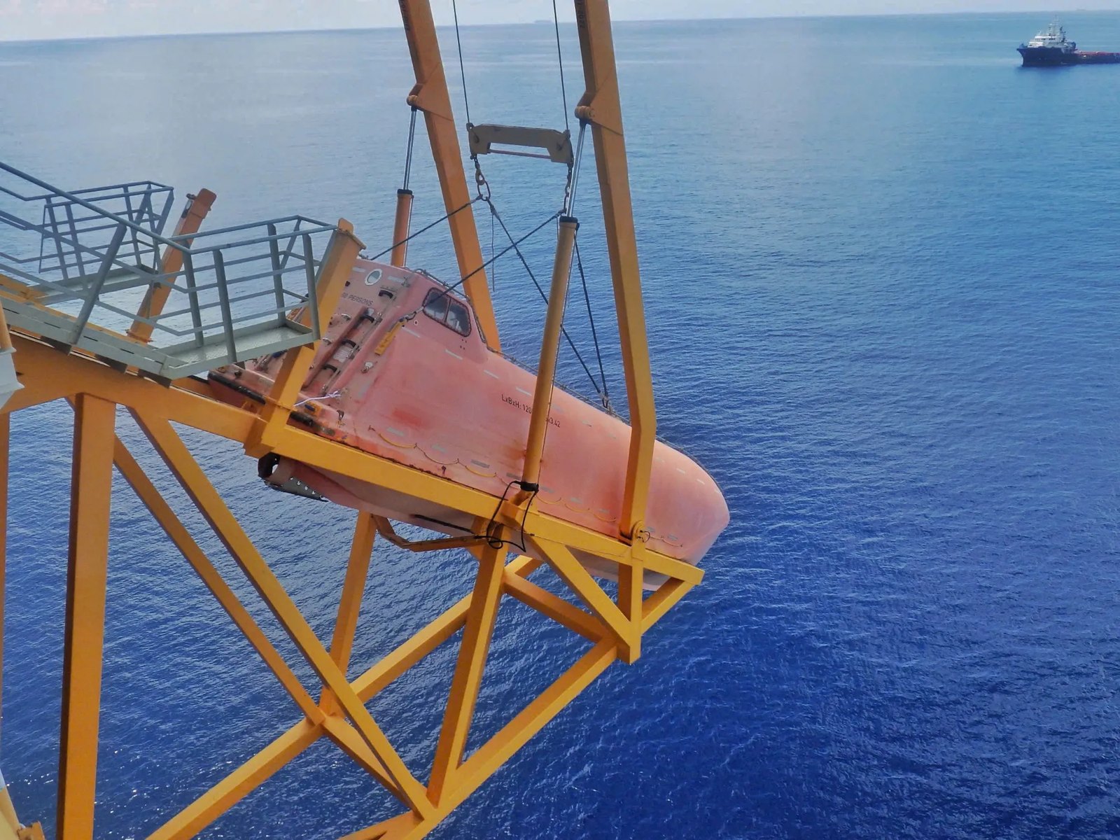 Freefall lifeboat on its launching davit at an offshore platform